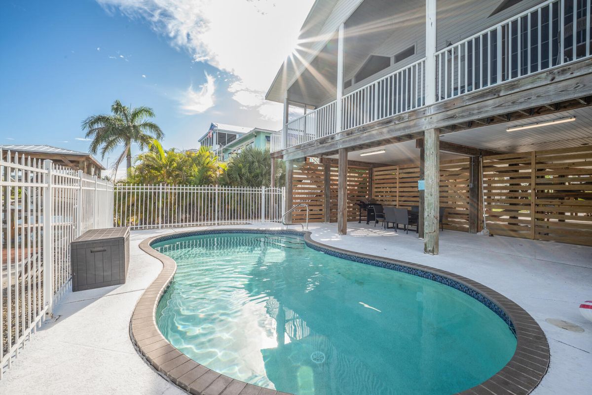 Curlew Pool House is a wonderful island vacation home...Coastal inspired style, an open-concept layout, and stunning waterfront views combine to create a welcoming space you'll look forward to vacationing in.