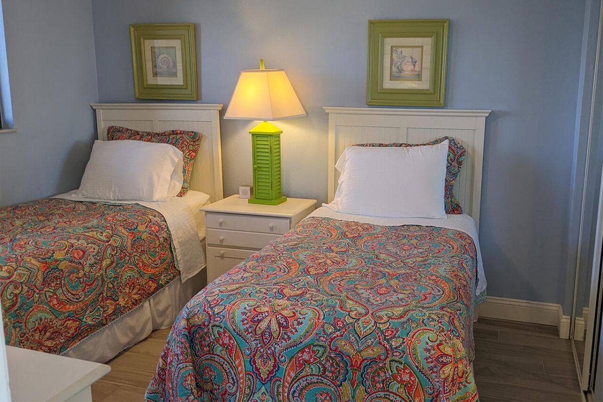 Guest suite has two twin beds and a large dresser.