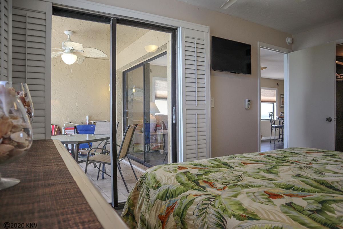 Master Bedroom has a King Sized Bed, its own TV and a private lanai access.
