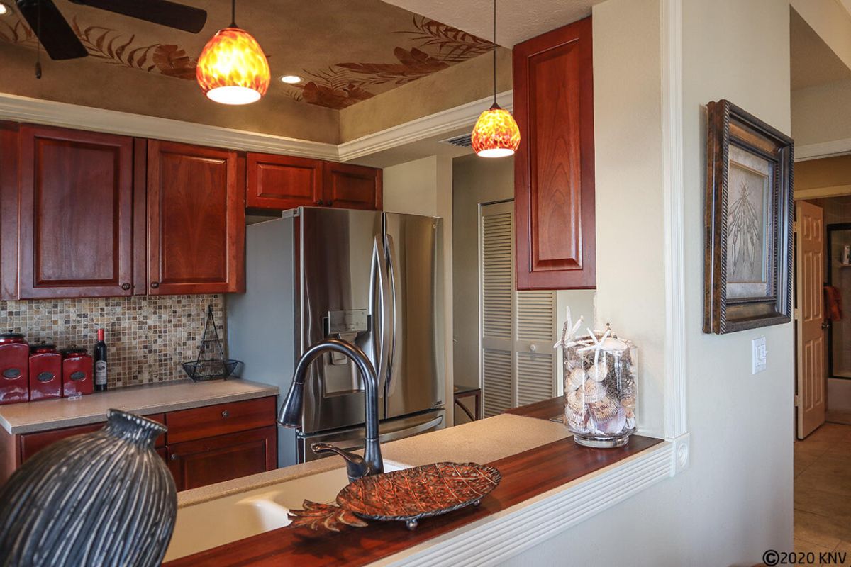 Custom cabinetry and artistic details feature throughout the updated interior.