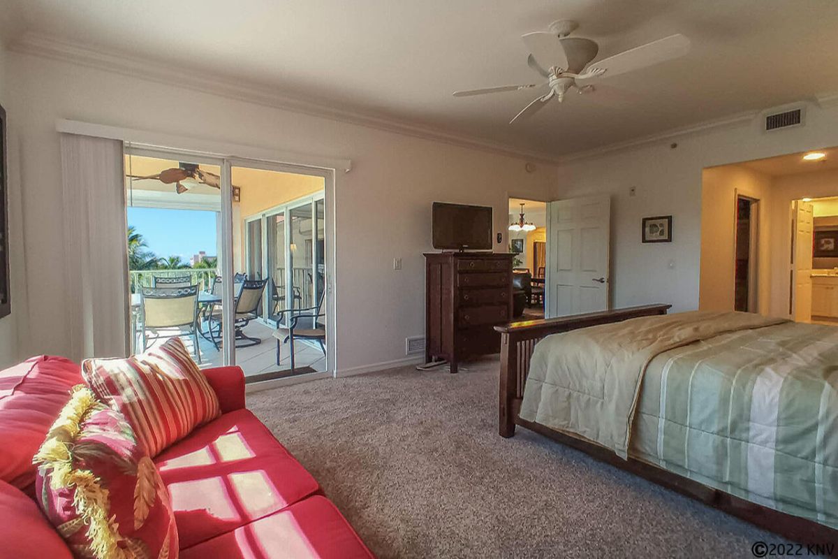 Master Bedroom has a private lanai access and its own TV