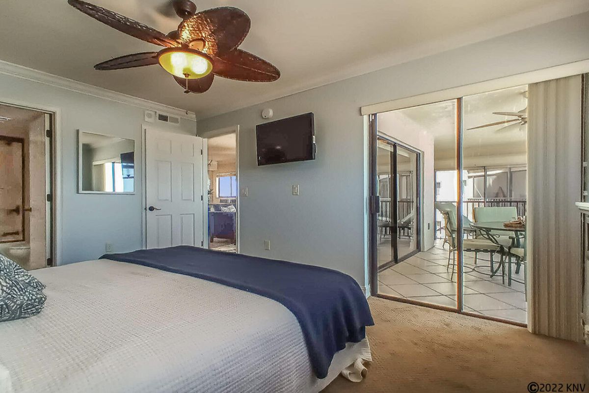 Master Bedroom has its own TV and private Lanai access.