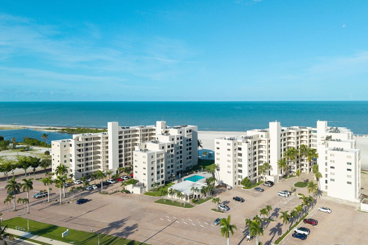 Escape the ordinary and find your paradise by the shore. Sandarac Beachfront Condominiums