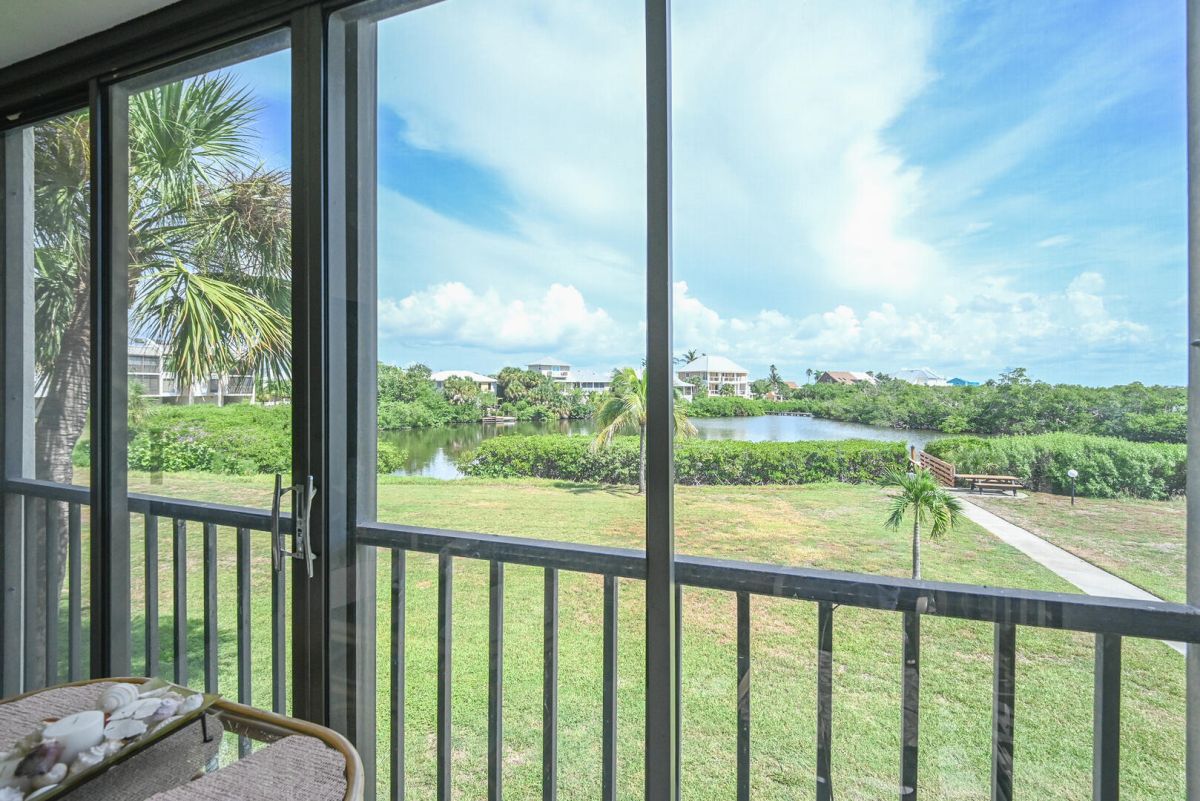Escape the ordinary and find your paradise on Fort Myers Beach. This lovely 2 Bedroom, 2 Bath vacation condo has a beautiful waterfront view from the screened in lanai...Bay Village 151