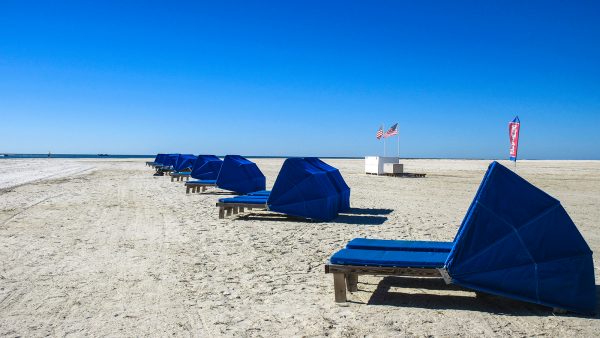 covered beach chairs on beach
