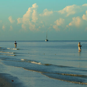 two men fishing off the gulf in fort myers beach